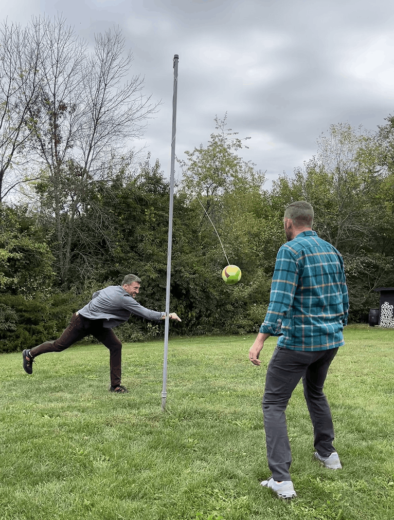 Two team members playing a game outdoors