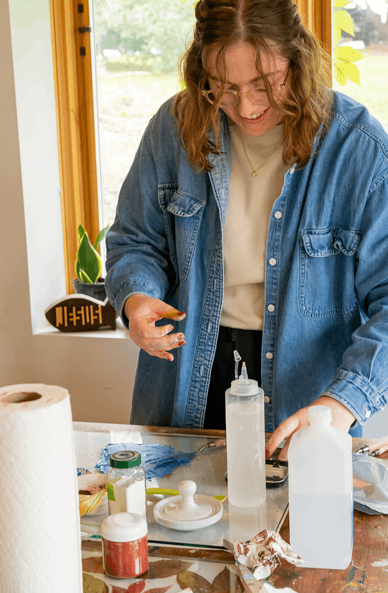 Team member working with supplies at a table