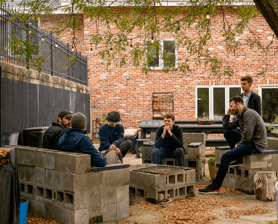 Team talking together in a courtyard